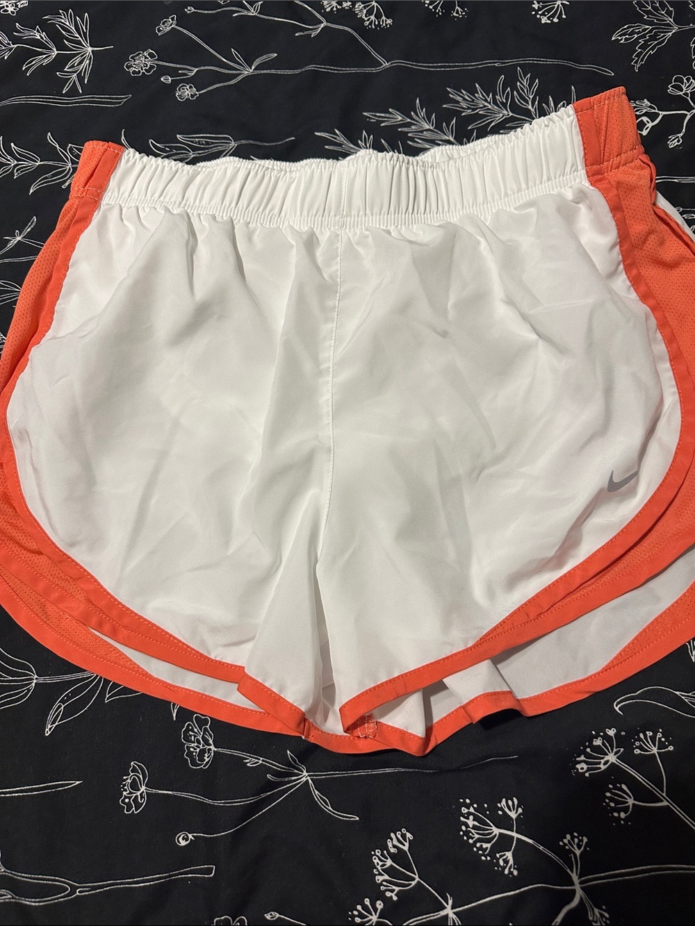 Nike Women's White Athletic Shorts with Orange Trim